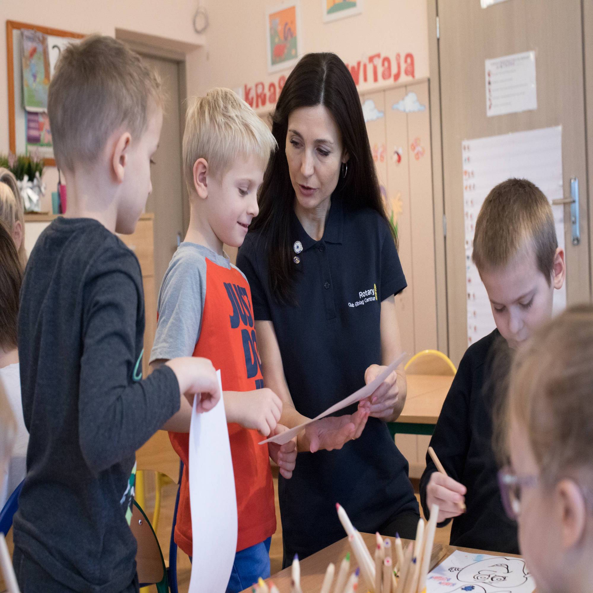 Members of the Rotary Club of Elblag Centrum, Elblag, Poland, distribute toothbrushing kits to kindergartners through the club’s Healthy Teeth Project. The project educates children on the importance of dental hygiene through annual presentations in schools. 22 November 2019. Elblag, Poland.